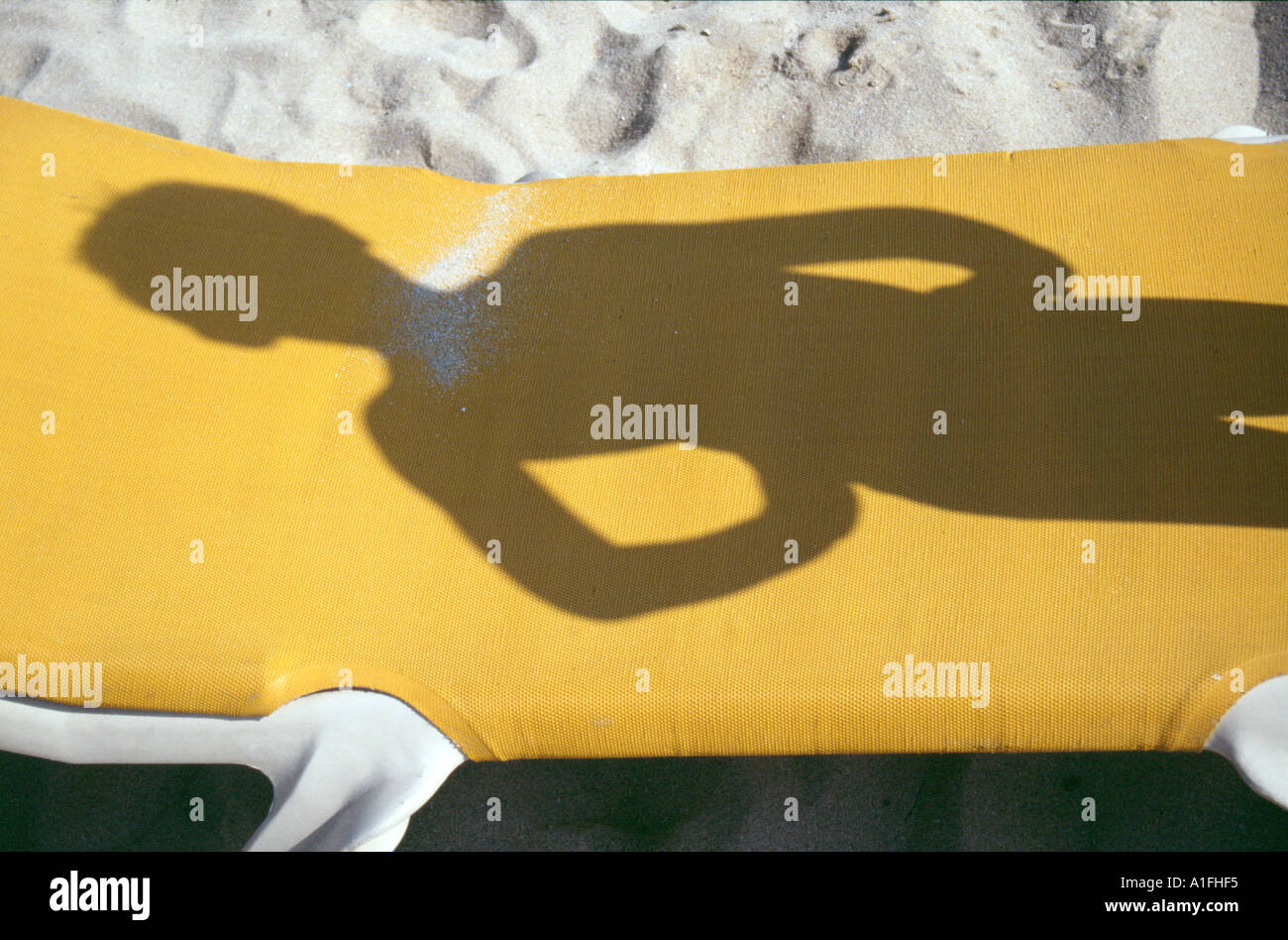 Shadow of boy on beach sun bed at Magalluf Majorca Mallorca Stock Photo