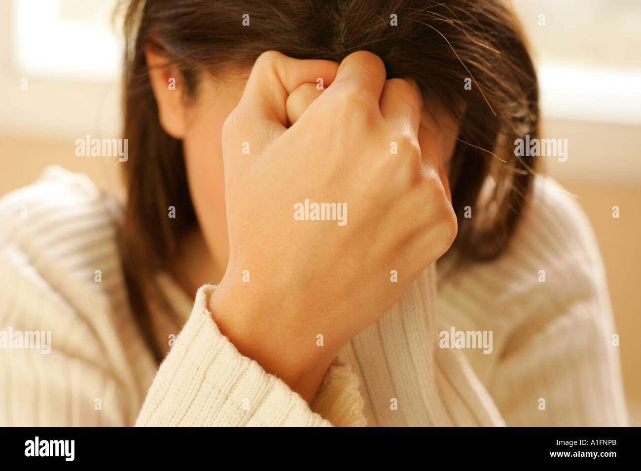 Woman clasping hands Stock Photo