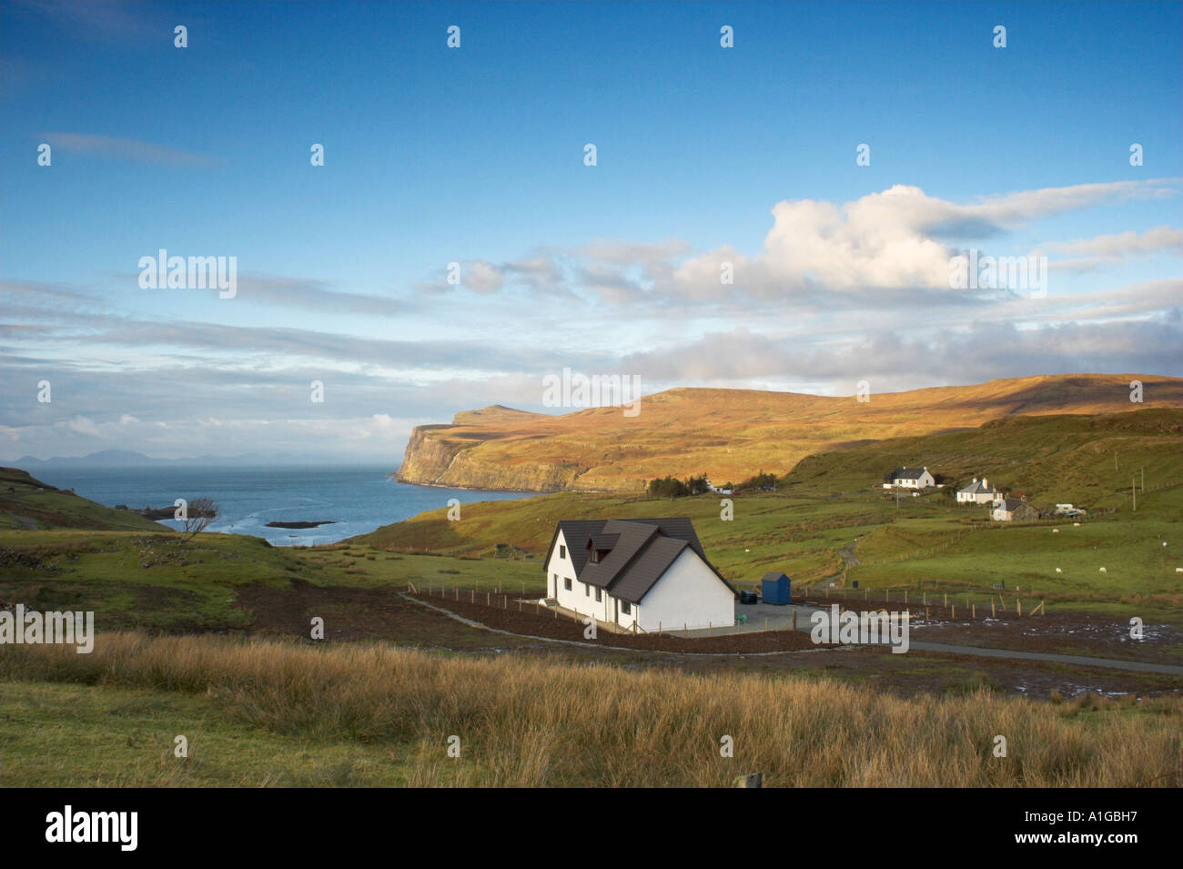 cottage on the isle of skye in scotland with Loch Pooltiel and the ...