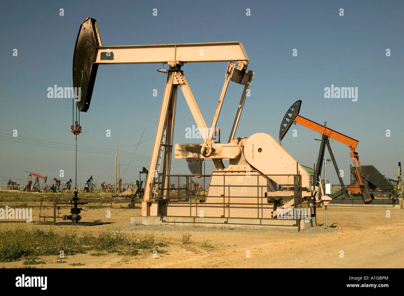 Nodding donkey oil pumps operating, California Stock Photo