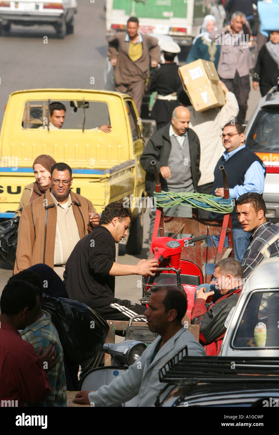 Traffic and pedestrian mix on a busy highway in central Cairo Stock Photo