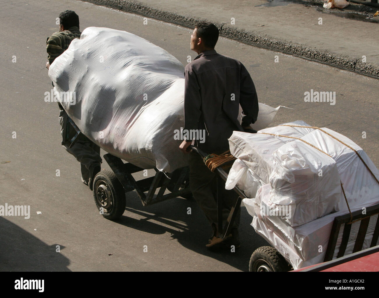 Men deliver goods by hand in Cairo,Egypt Stock Photo