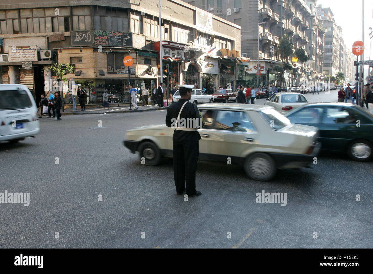 A Traffic warden directs traffic in Cairo’s city centre. Stock Photo