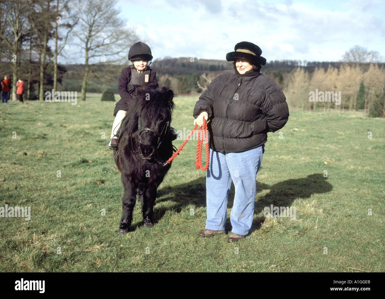 Lincolnshire Wolds small child on tiny pony with mother Stock Photo