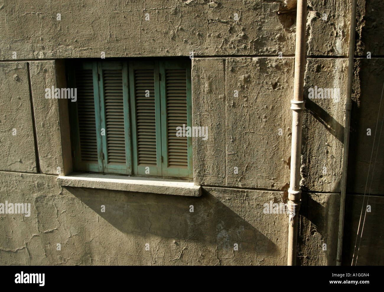 A window on a tower block in Cairo, Egypt has its window closed with