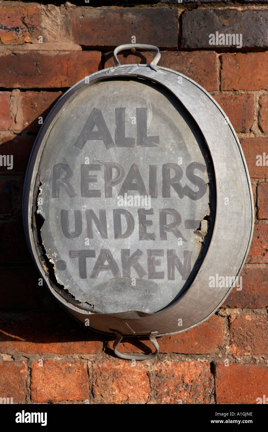 old tin bath hanging on a wall, blist hill Victorian museum, Shropshire