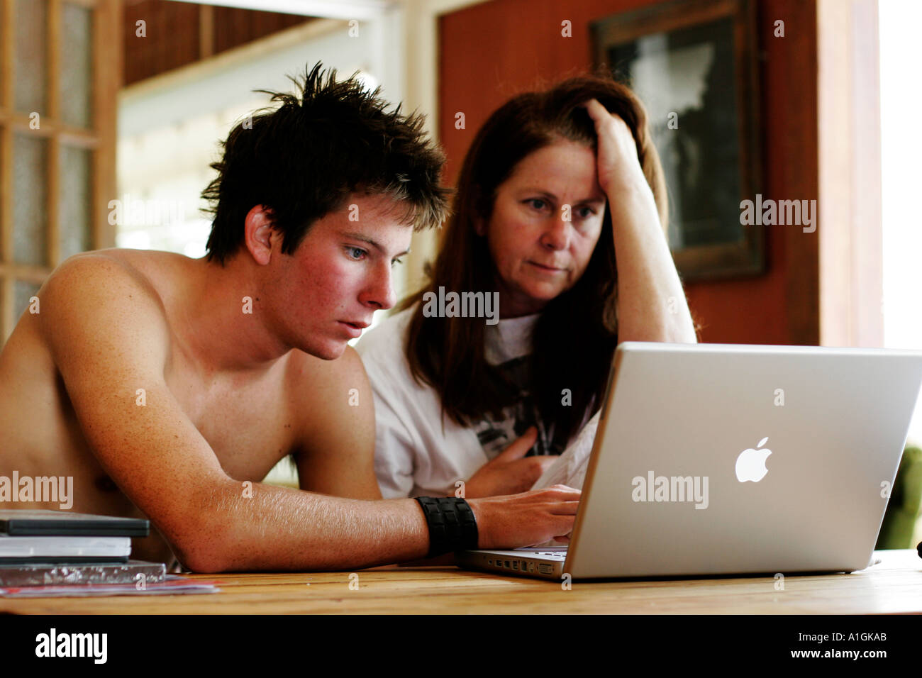 Mother and son work on computer Stock Photo