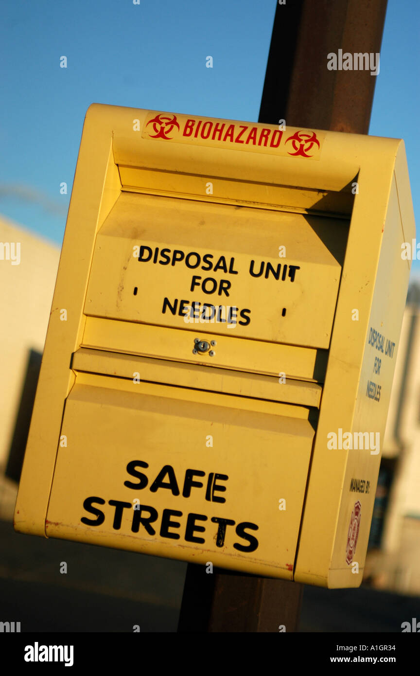 Needle disposal box for drug users on the street Stock Photo Alamy