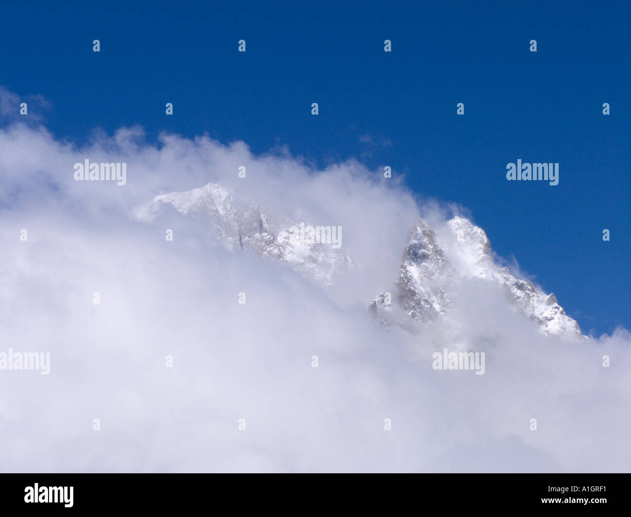 CLOUD OVER SNOW CAPPED MOUNTAIN Stock Photo - Alamy