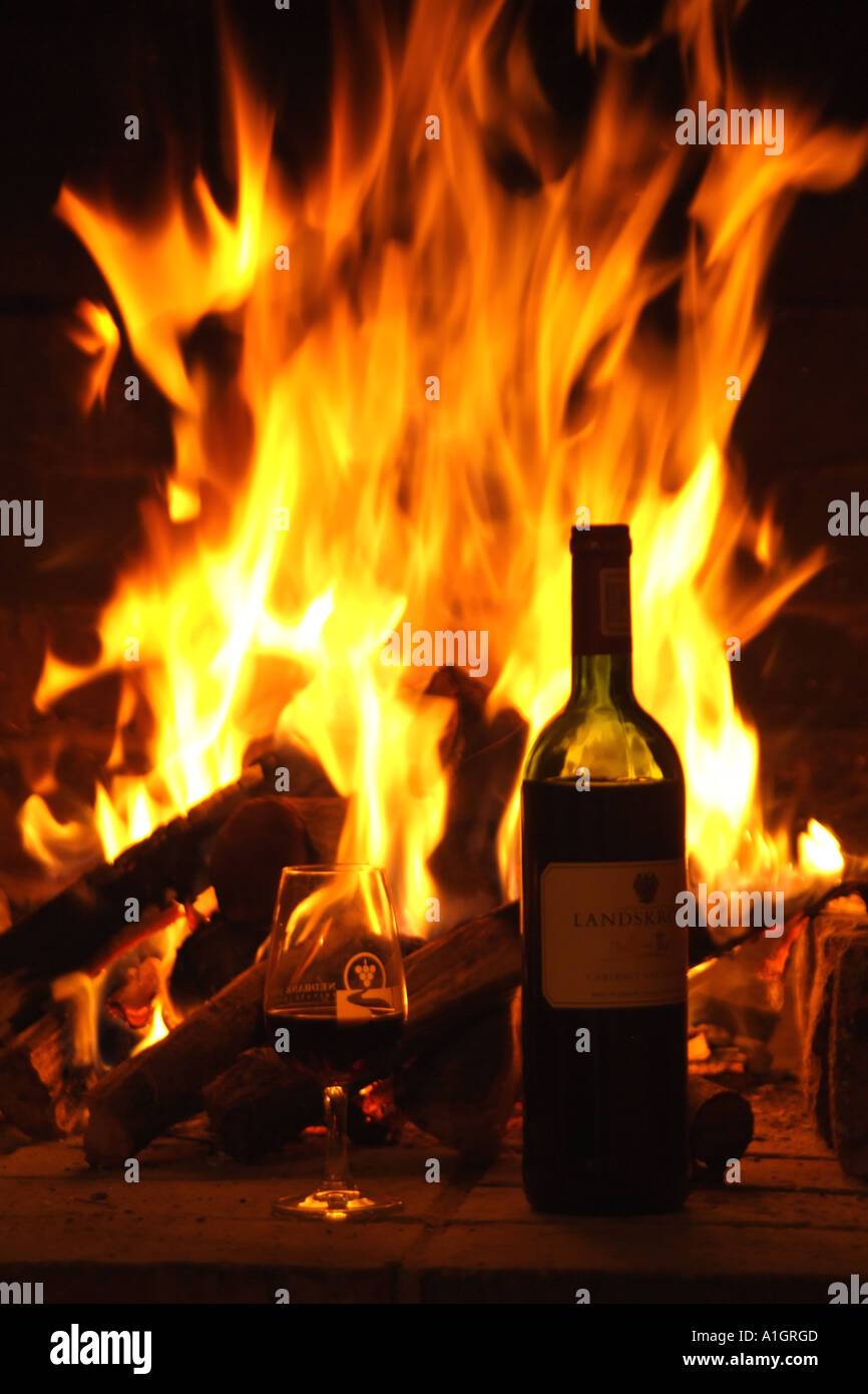 wood burning fire flames bottle wine alight Stock Photo Alamy