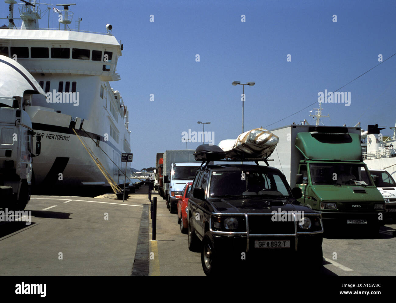 Cars and vans queueing to board Car Ferry Liner Jadrolinija docked at Split Harbour Croatia Dalmatia Makarska Adriatic Sea Ma Stock Photo