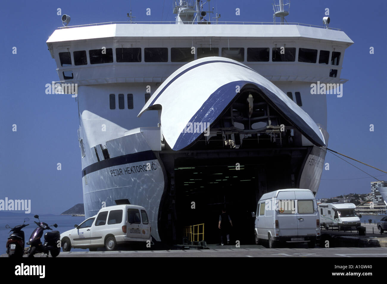 Transport waiting to embark Car Ferry Liner Jadrolinija docked at Split Harbour Croatia Dalmatia Makarska Adriatic Sea May 2004 Stock Photo