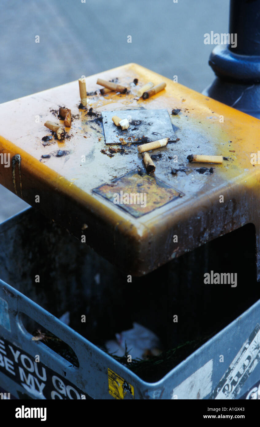 Cigarette ends on top of a rubbish bin Karlsruhe Germany Stock Photo