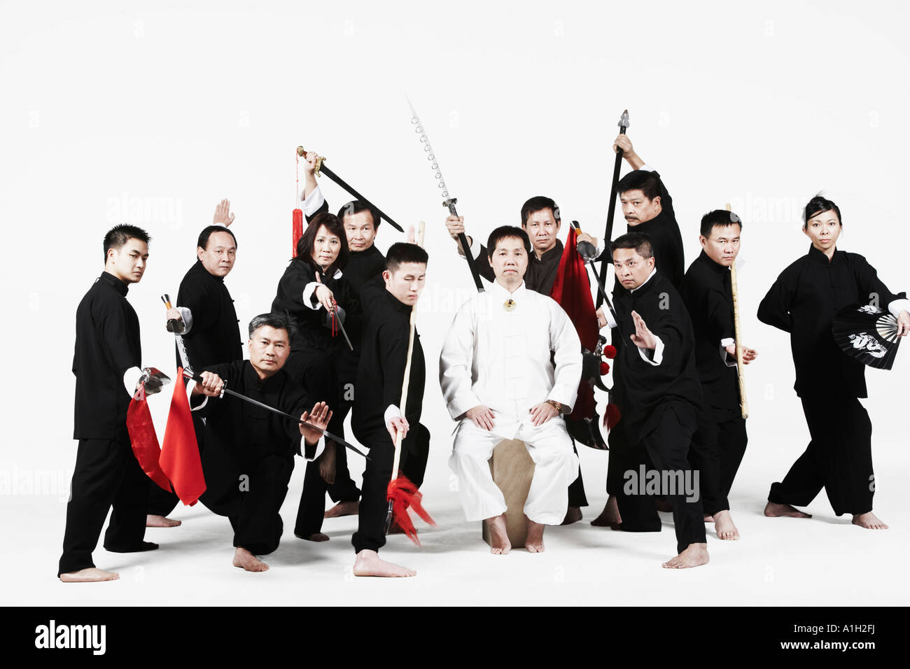 Portrait of a group of people gesturing with weapons Stock Photo