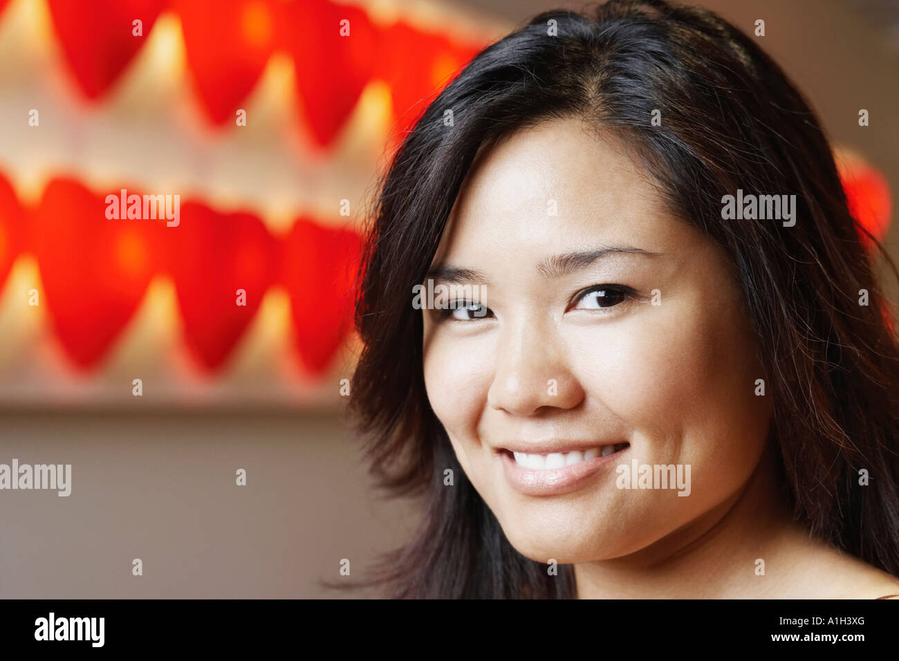 Portrait of a young woman smiling Stock Photo - Alamy