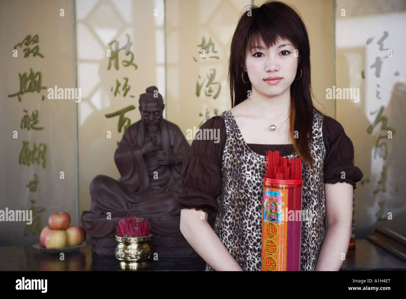 Woman hold incense indoors hi-res stock photography and images - Alamy