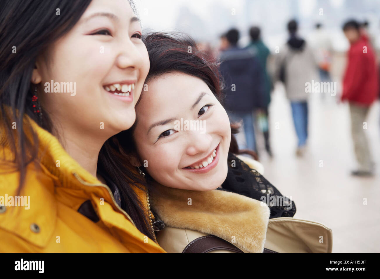 Close-up of two young women smiling Stock Photo - Alamy