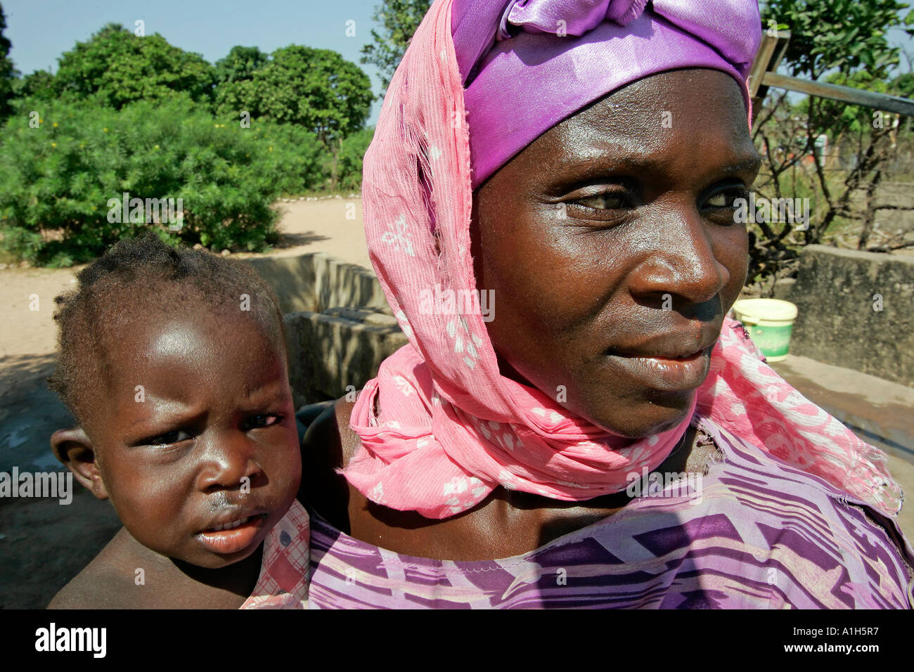 Woman and child on hip Berending village south of The Gambia Stock ...