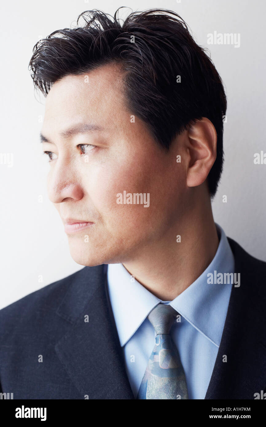 Close-up of a businessman looking sideways smiling Stock Photo