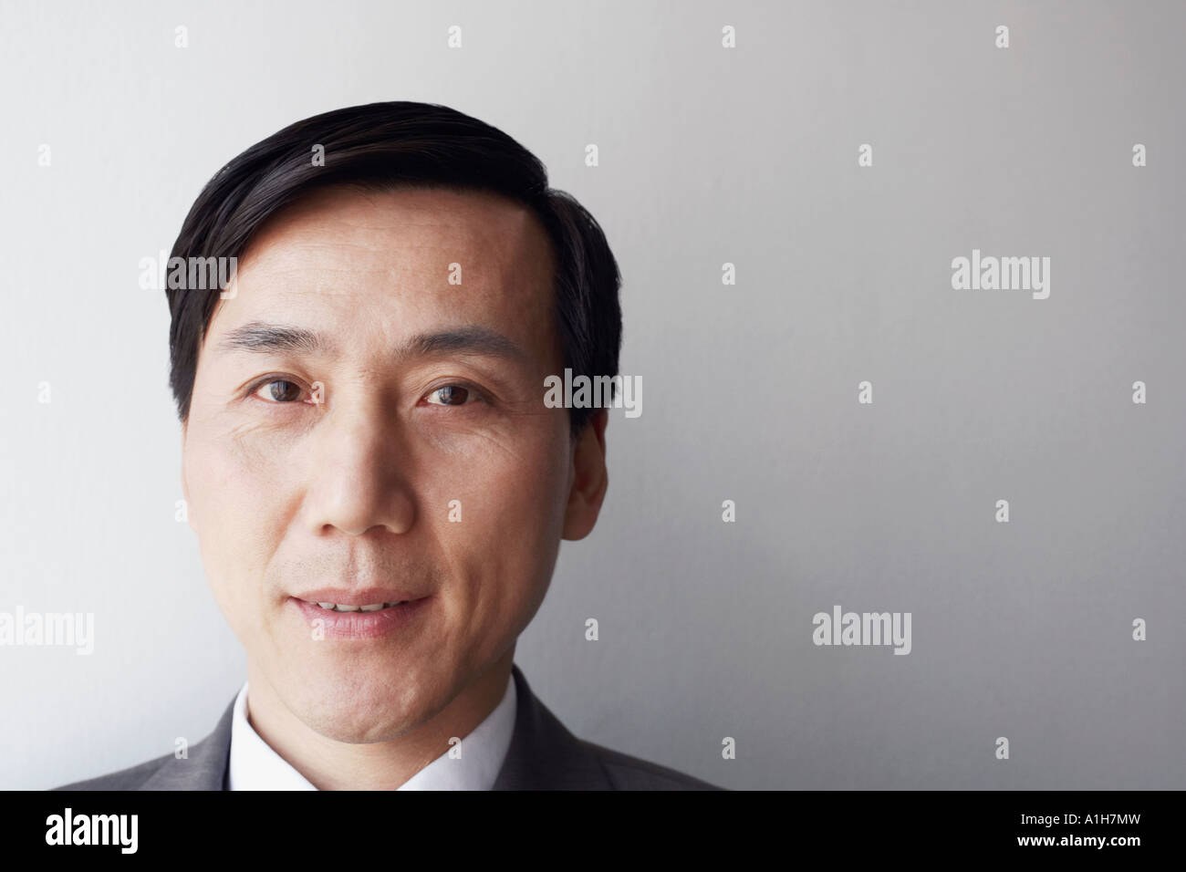 Portrait of a businessman smiling Stock Photo - Alamy