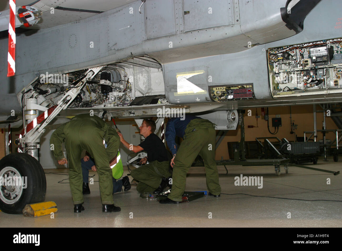 Engineers working on RAF Tornado fighter bomber jet aircraft Stock