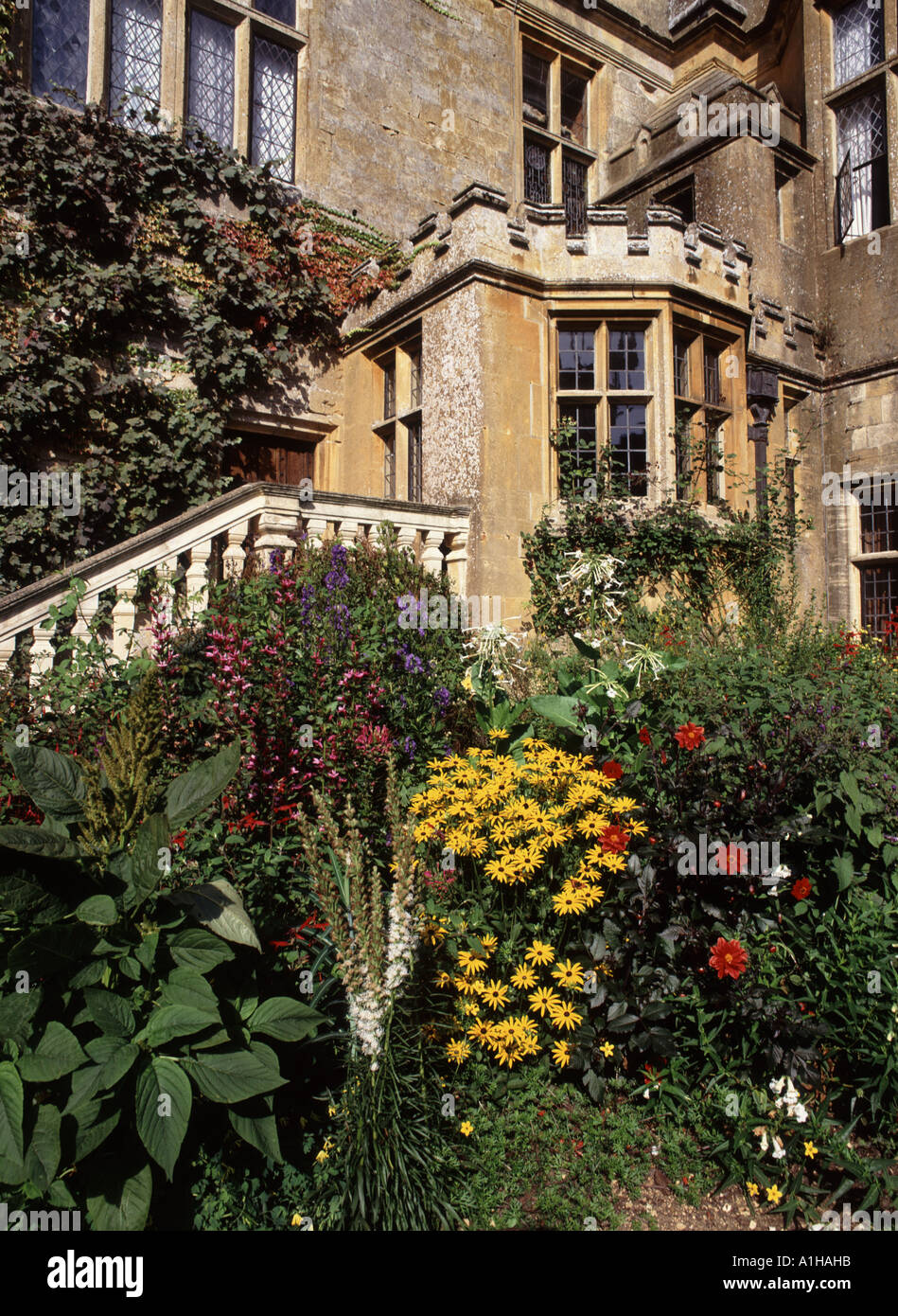 Stone steps beside a door way at Sudeley Castle with its fine gardens in the cotswolds  once the home of Katherine Parr Stock Photo