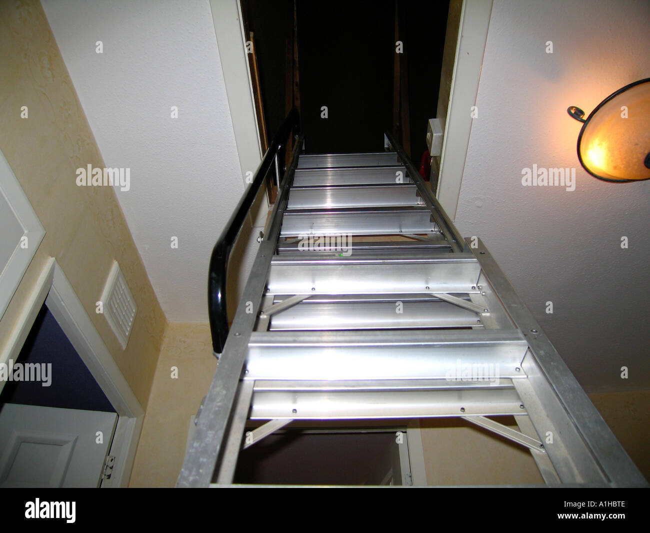 Aluminium loft ladder in hatch Stock Photo