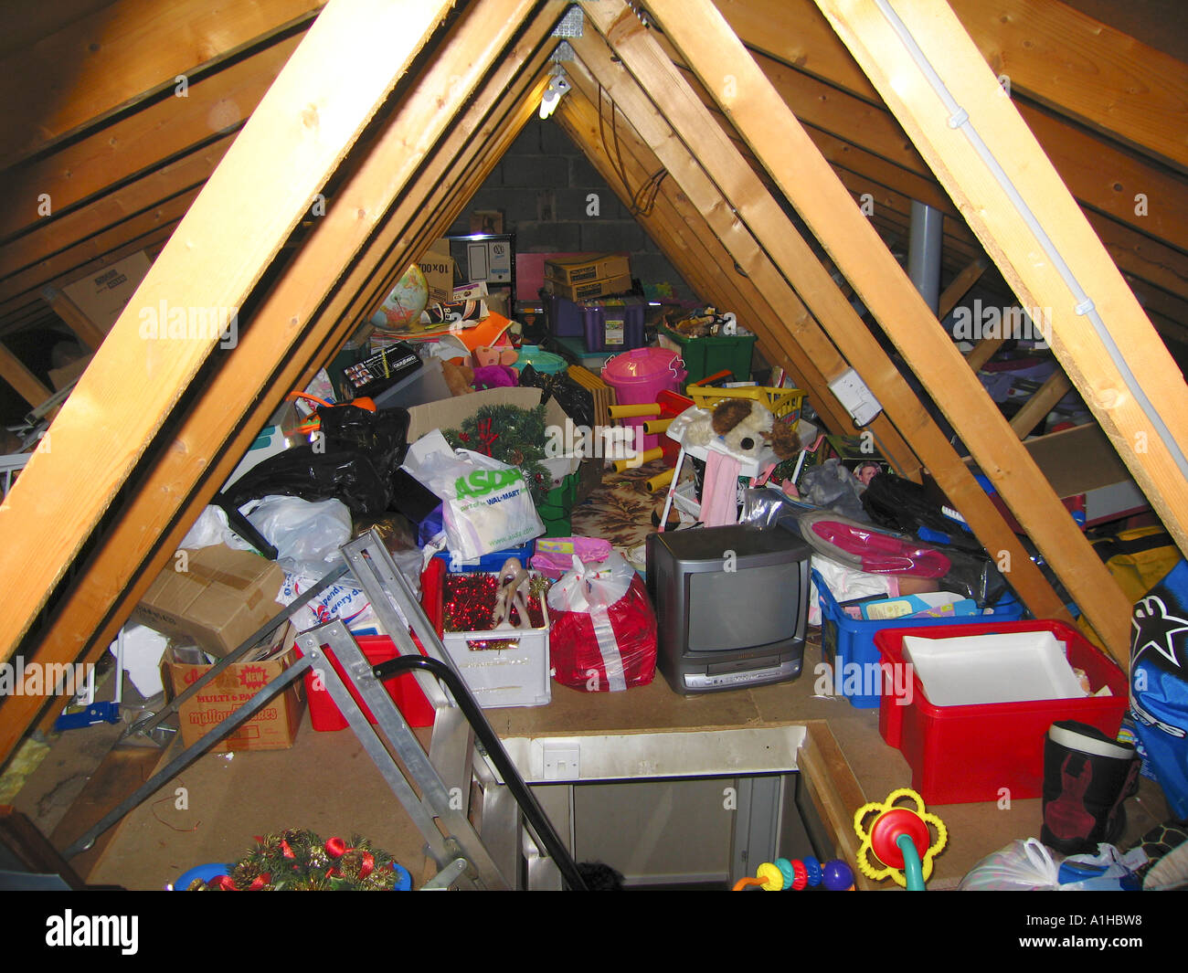 Typical domestic attic loft full of accumulated rubbish Stock Photo