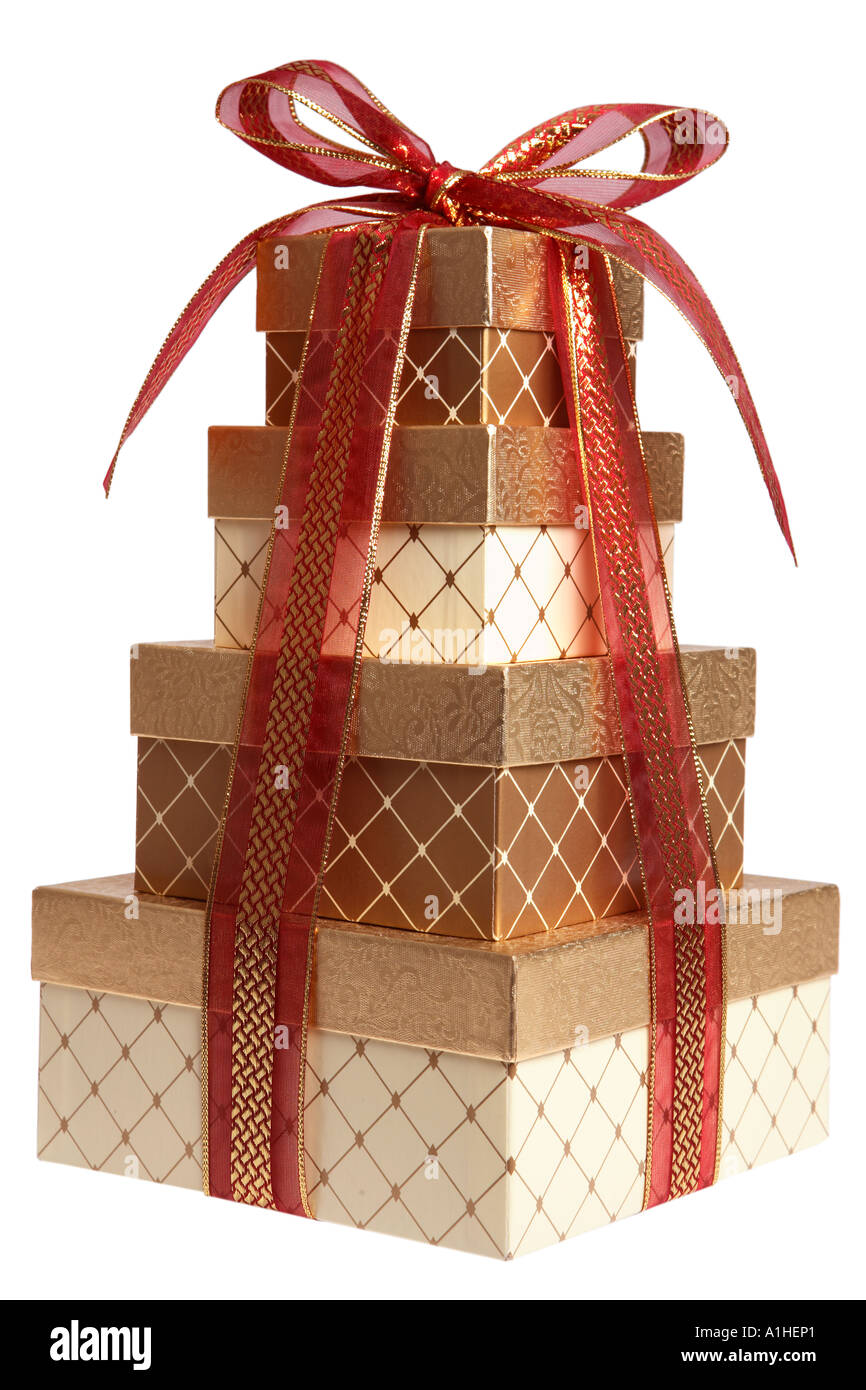 Stack of Christmas presents wrapped in gold and red Stock Photo