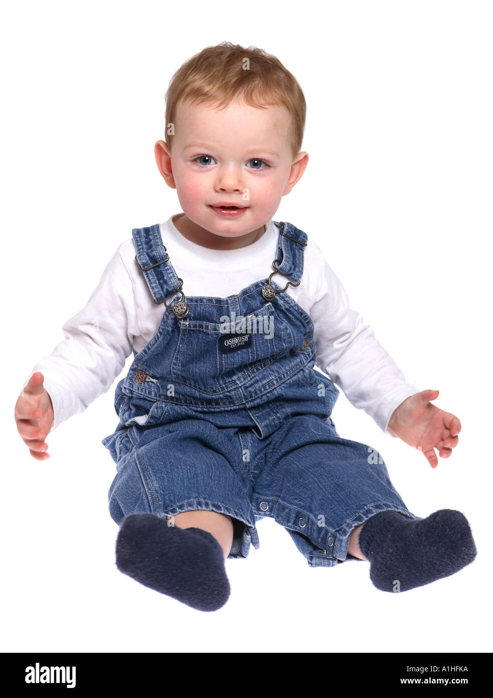 18 month old toddler wearing overalls Stock Photo