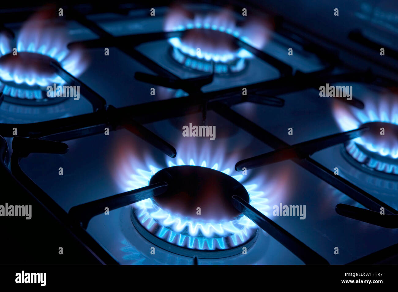 FOUR BURNING RINGS ON GAS COOKER HOB Stock Photo Alamy