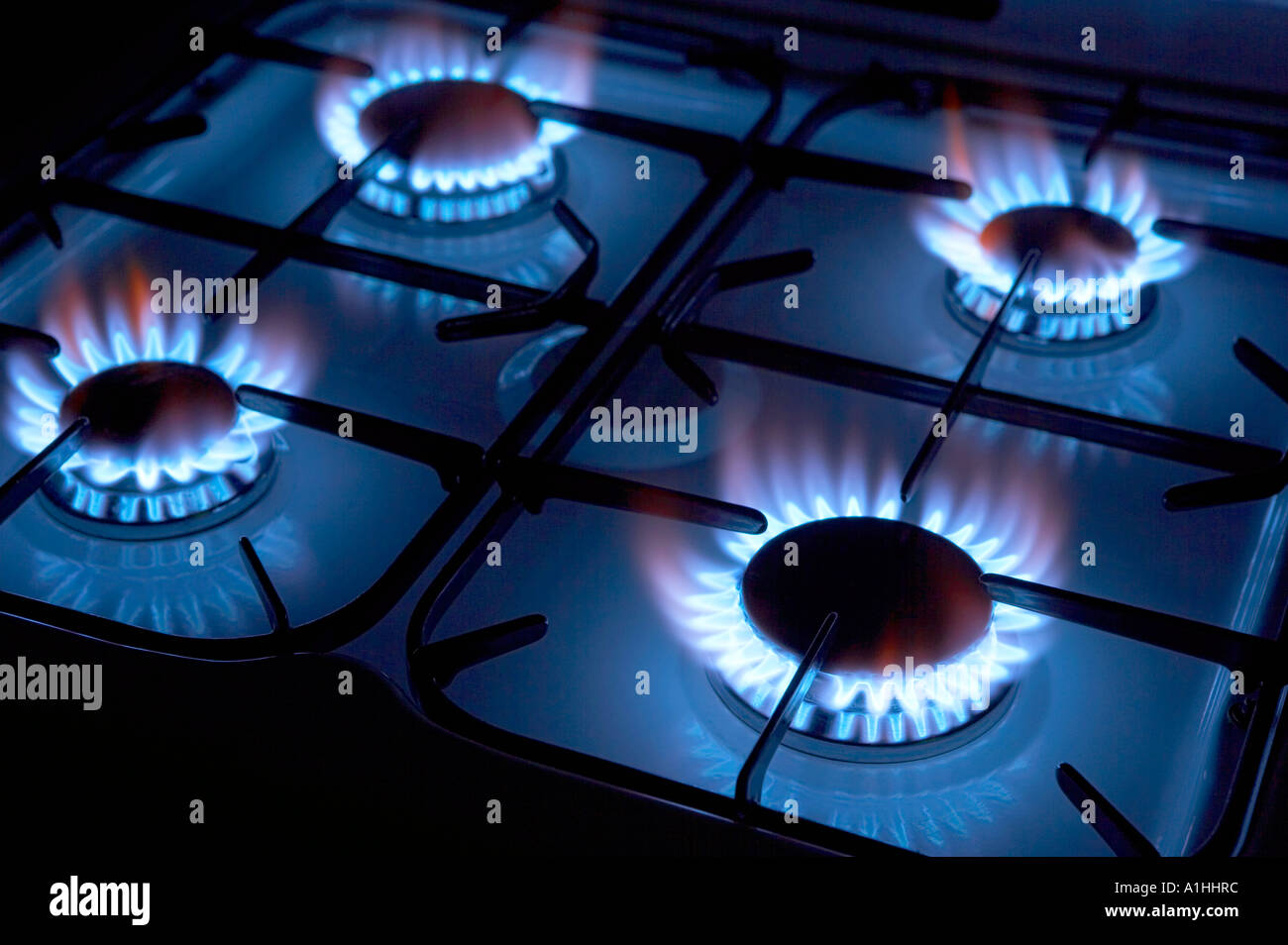 FOUR BURNING RINGS ON GAS COOKER HOB Stock Photo Alamy