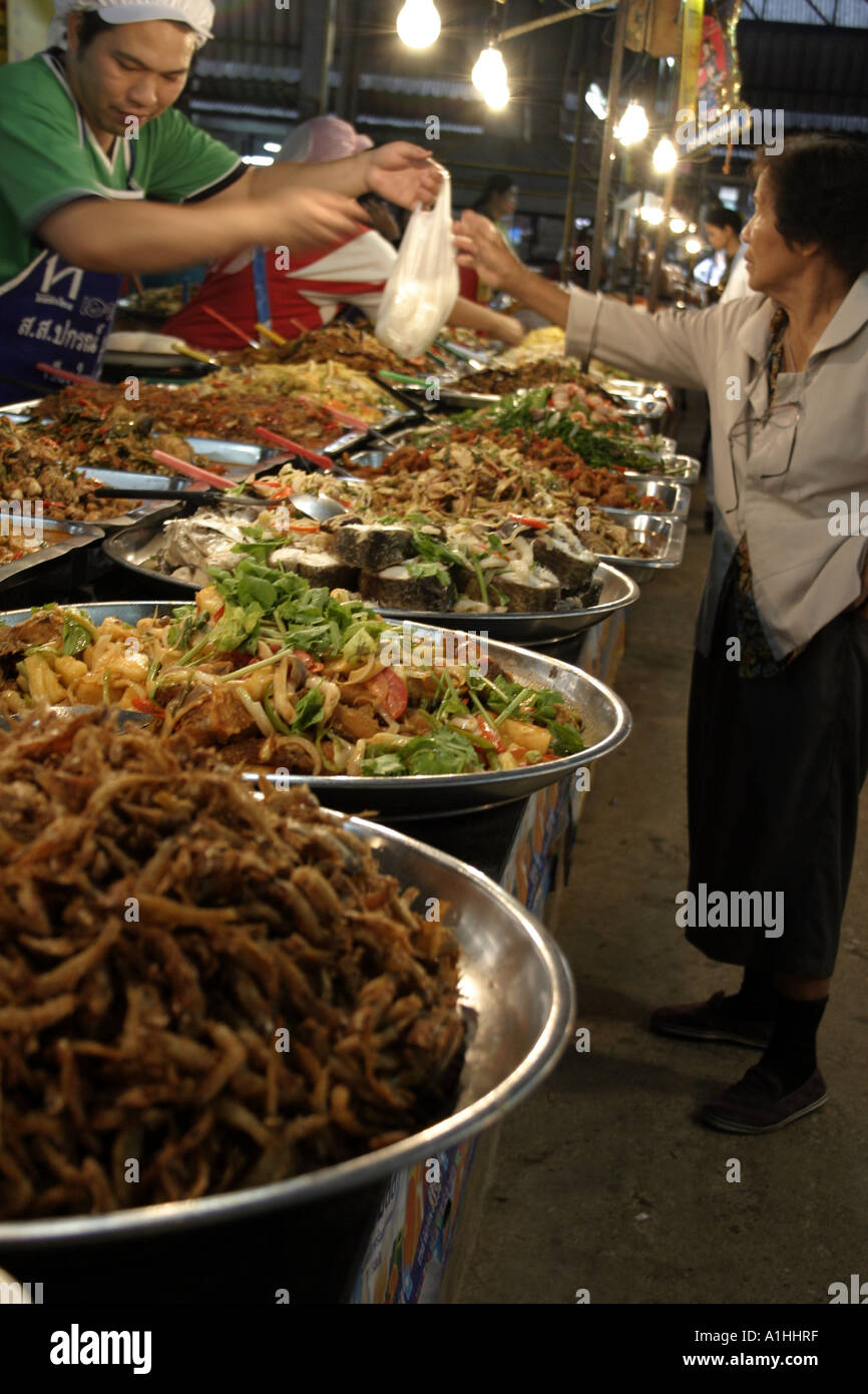 Trader serving lady at fast food market in Thailand Asia Stock Photo