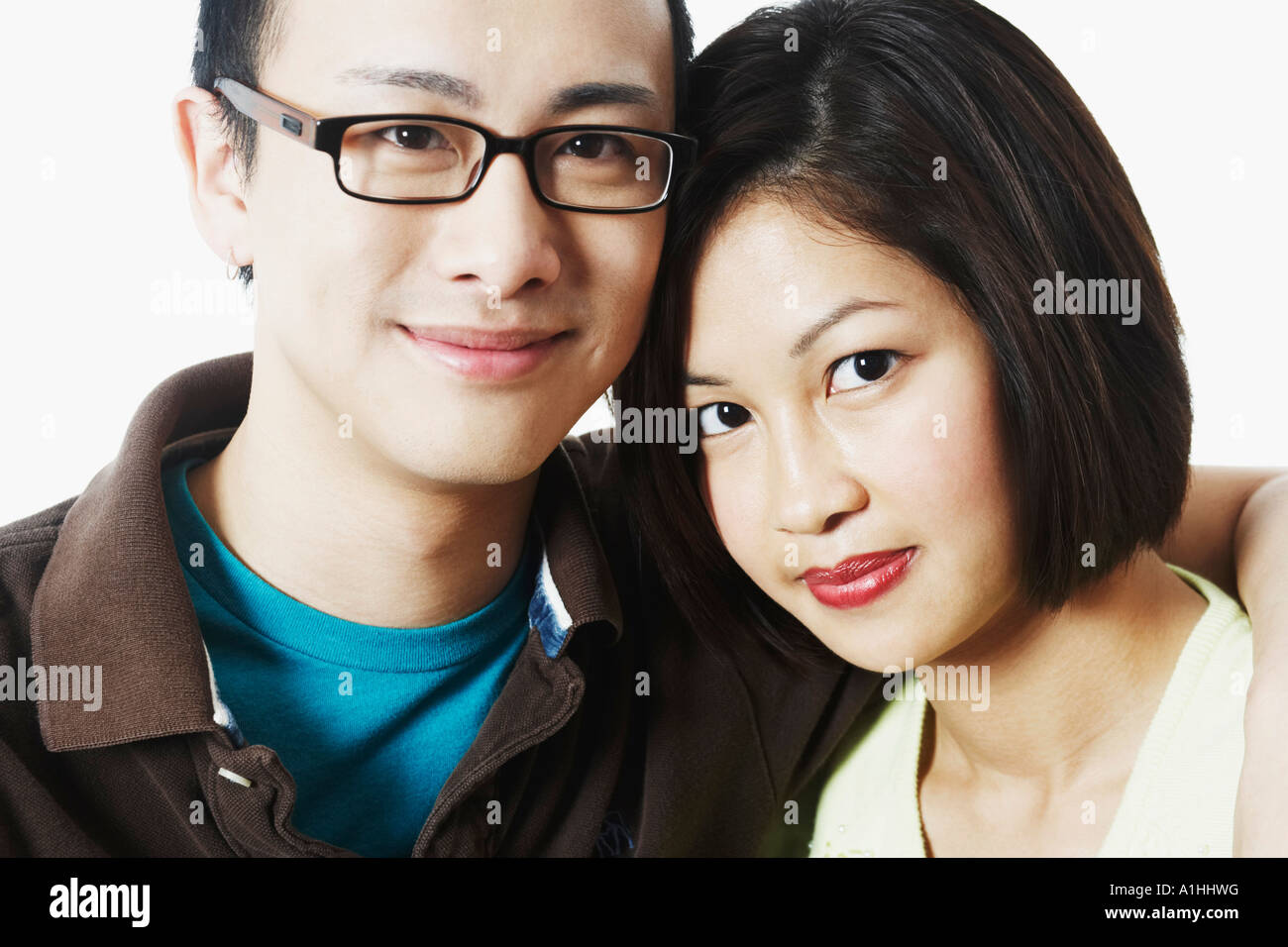 Portrait of a young man embracing a young woman Stock Photo - Alamy