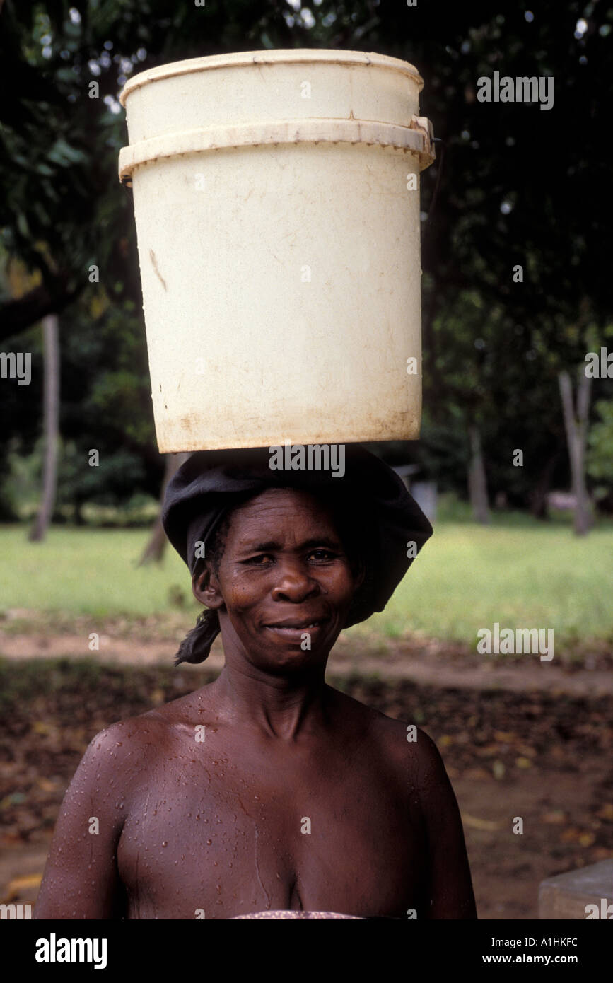 Woman carrying a water bucket in Kwale Kenya Stock Photo Alamy