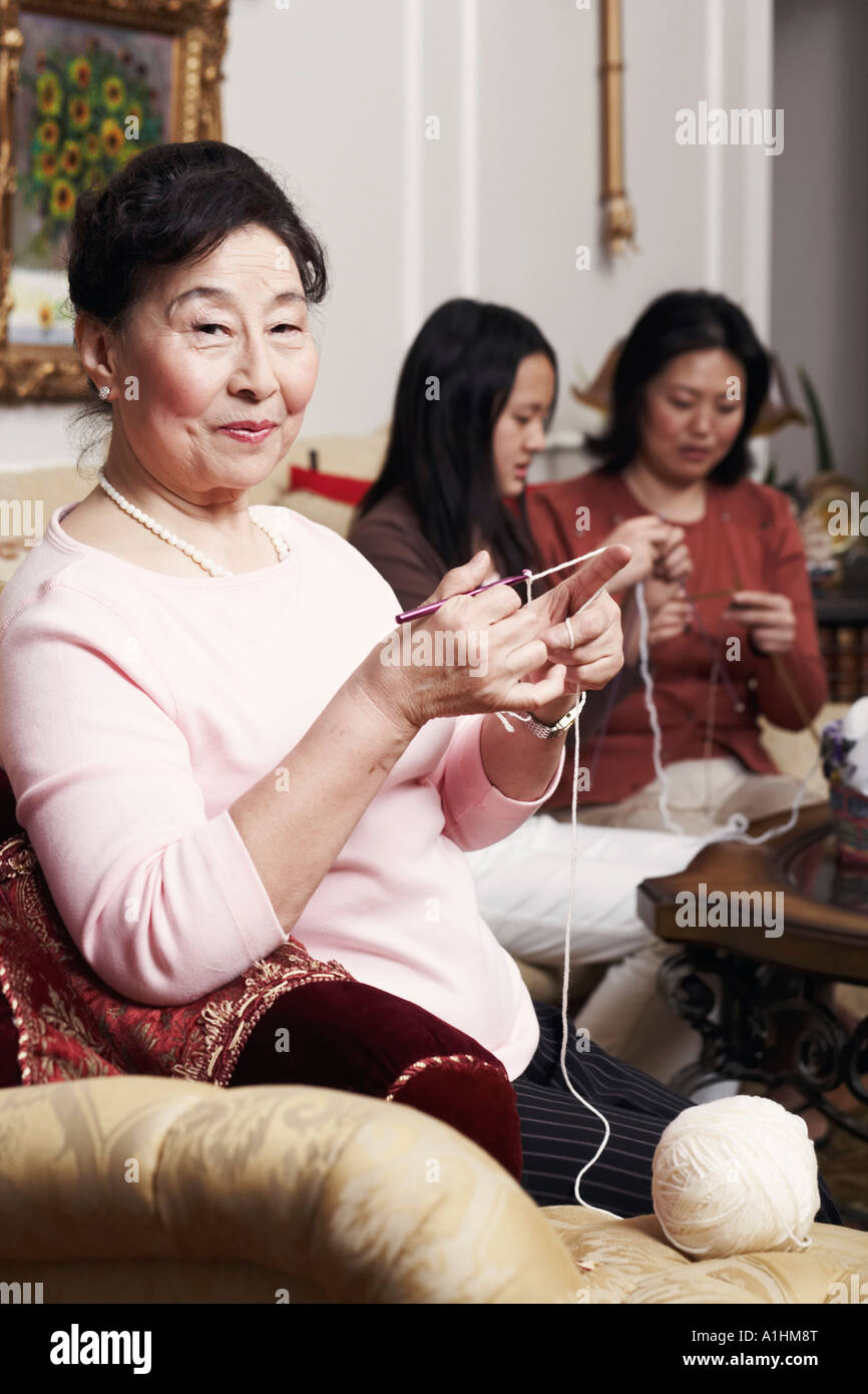 Portrait of a senior woman knitting Stock Photo - Alamy