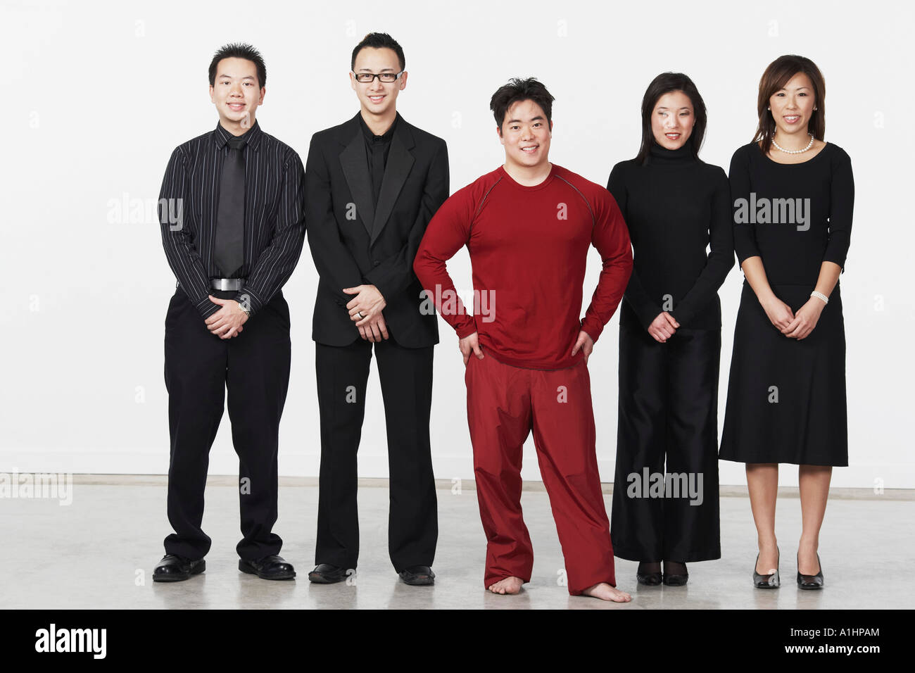Portrait of three young men and two young women standing Stock Photo ...