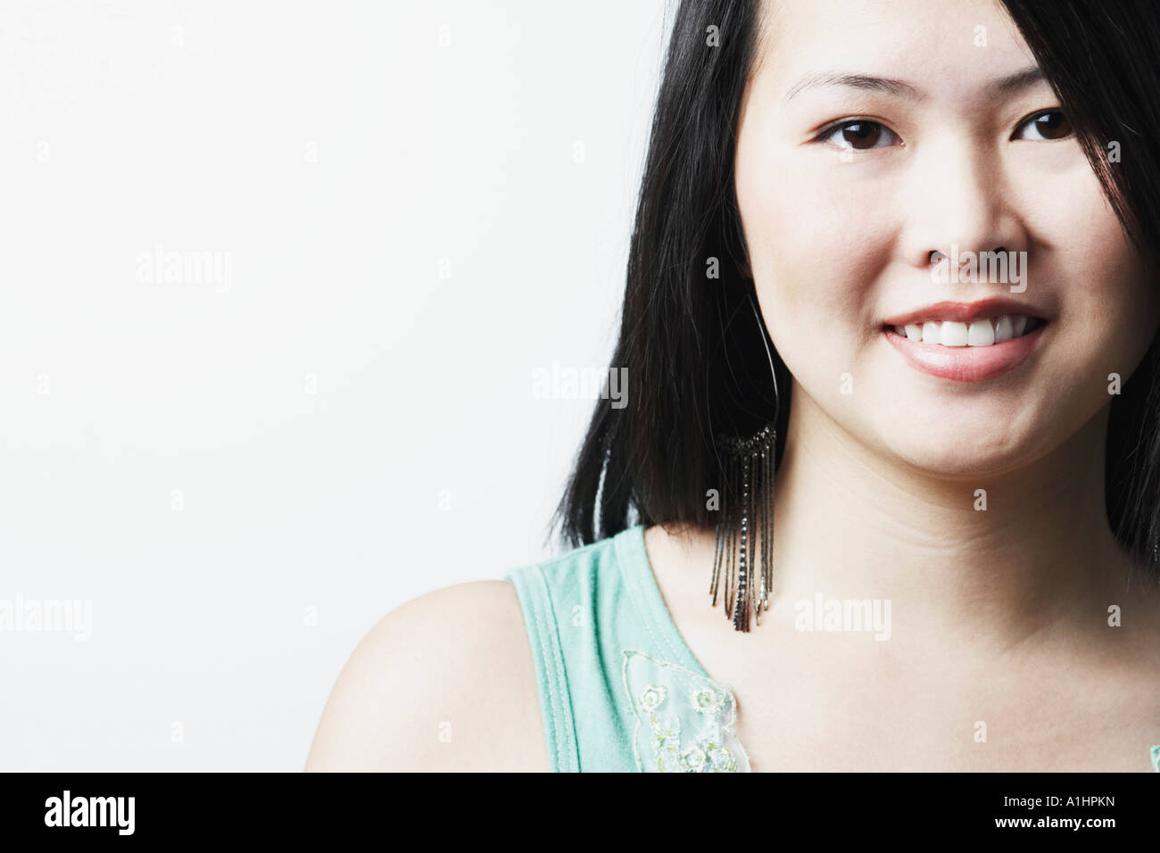 Portrait of a young woman smiling Stock Photo - Alamy
