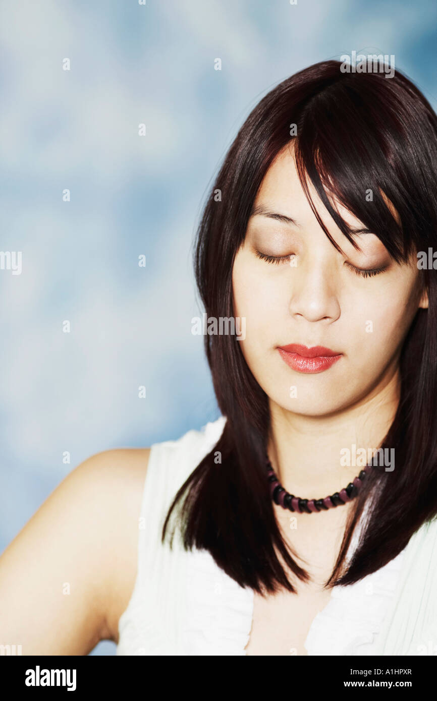 Close-up of a young woman with her eyes closed Stock Photo