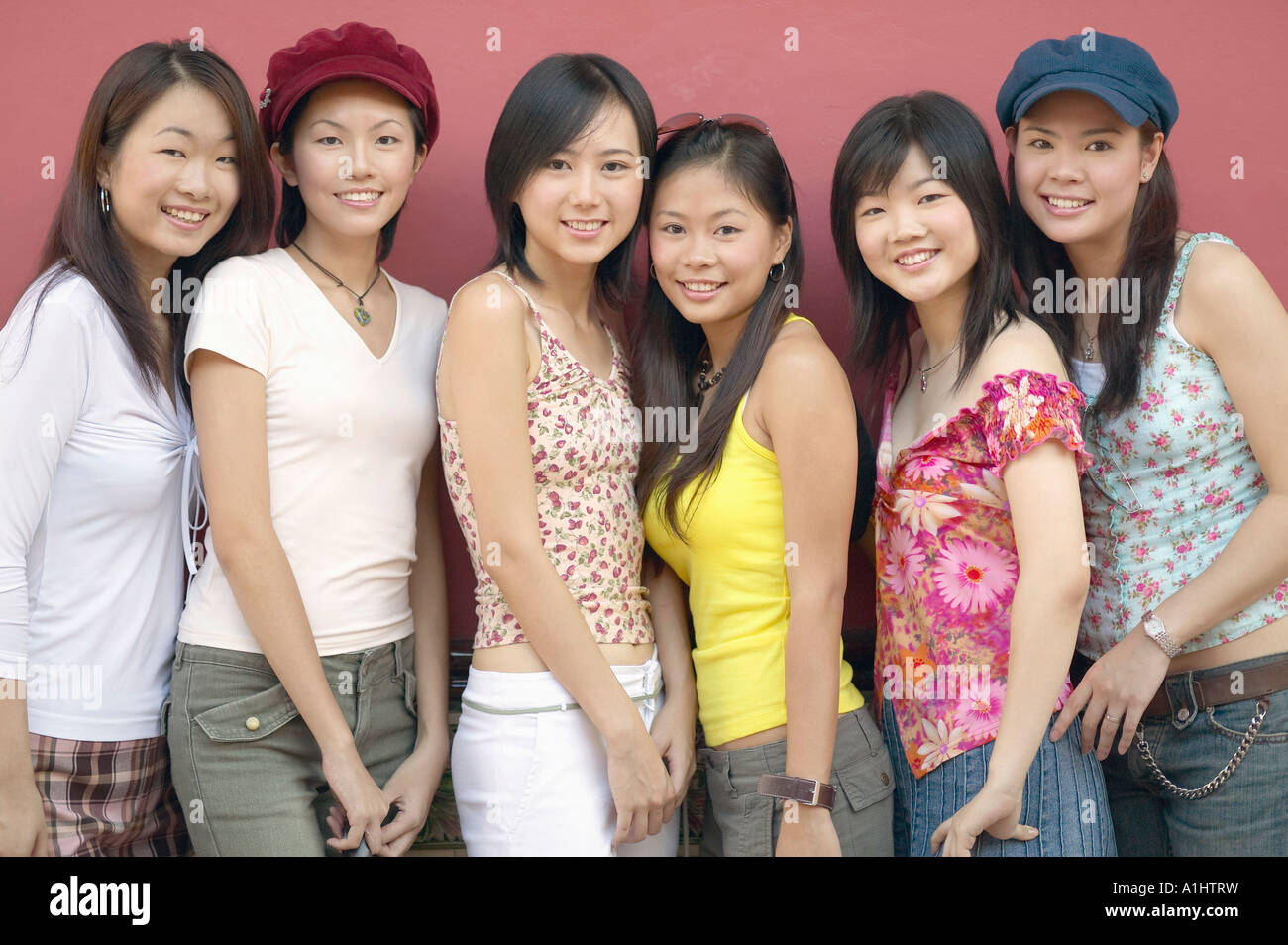 Portrait of a group of young women smiling Stock Photo - Alamy