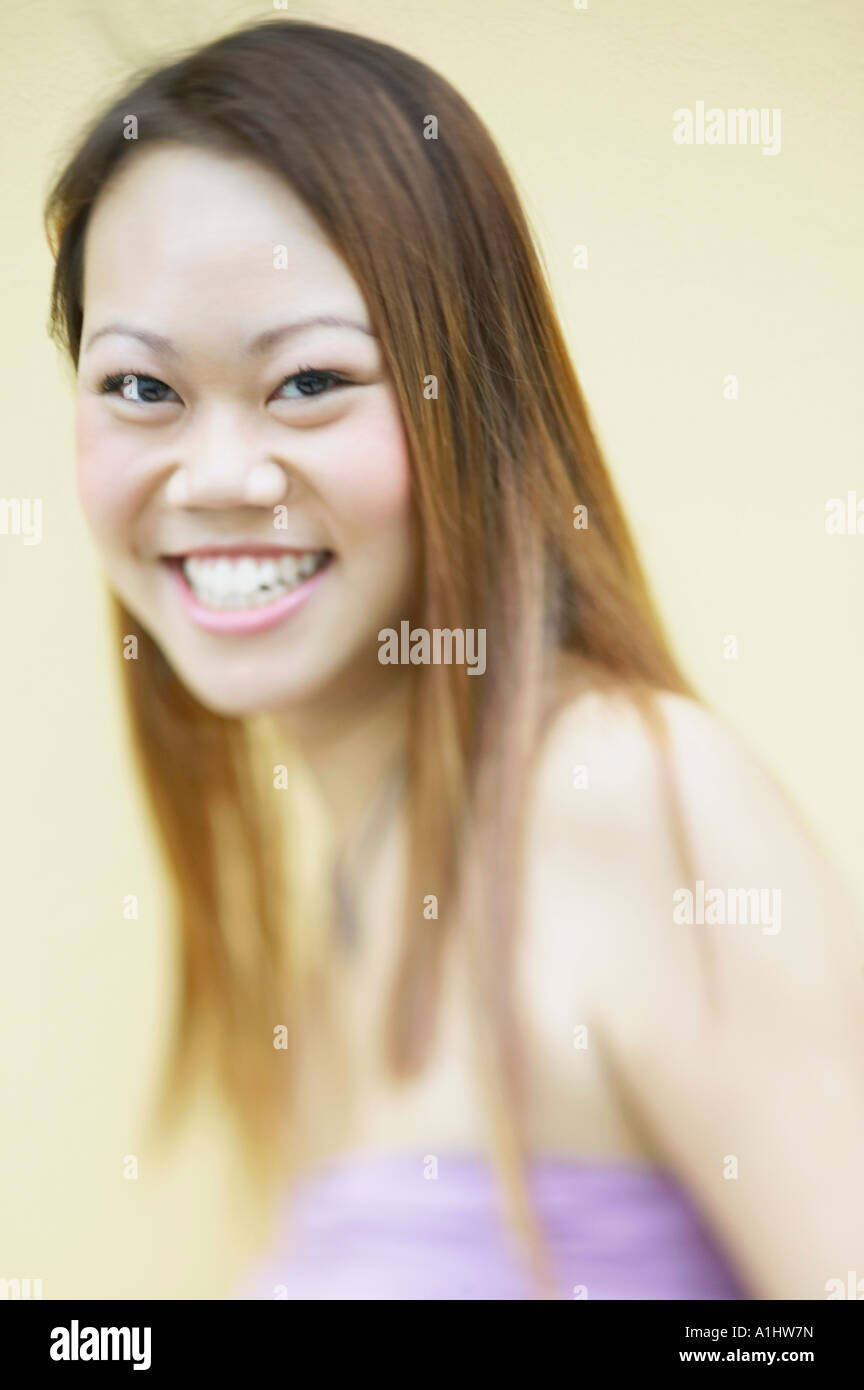 Portrait of a young woman smiling Stock Photo - Alamy
