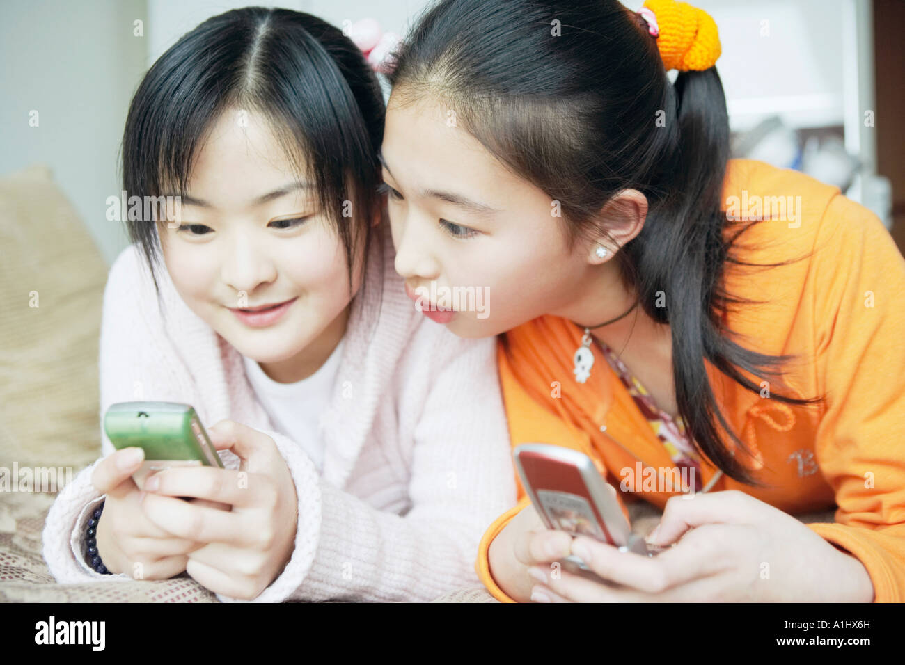 Two women using handy hi-res stock photography and images - Alamy