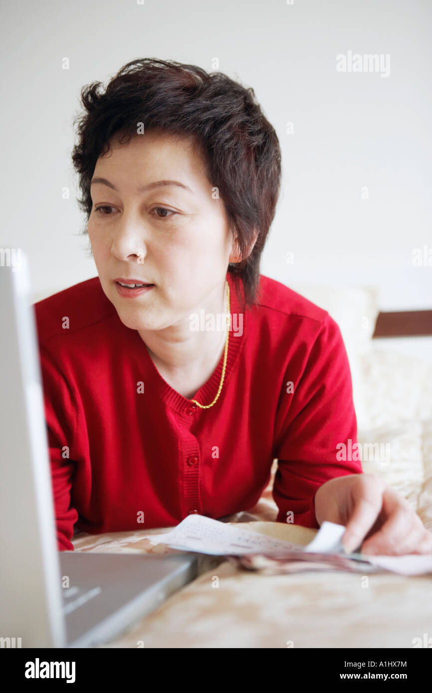 Close-up of a mature woman using a laptop Stock Photo