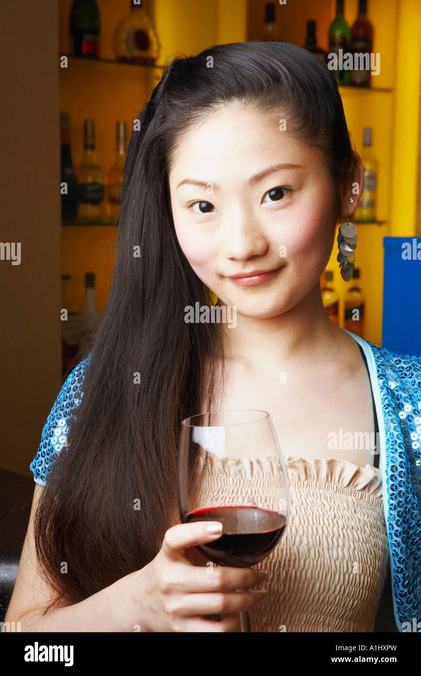Portrait of a teenage girl holding a wineglass Stock Photo