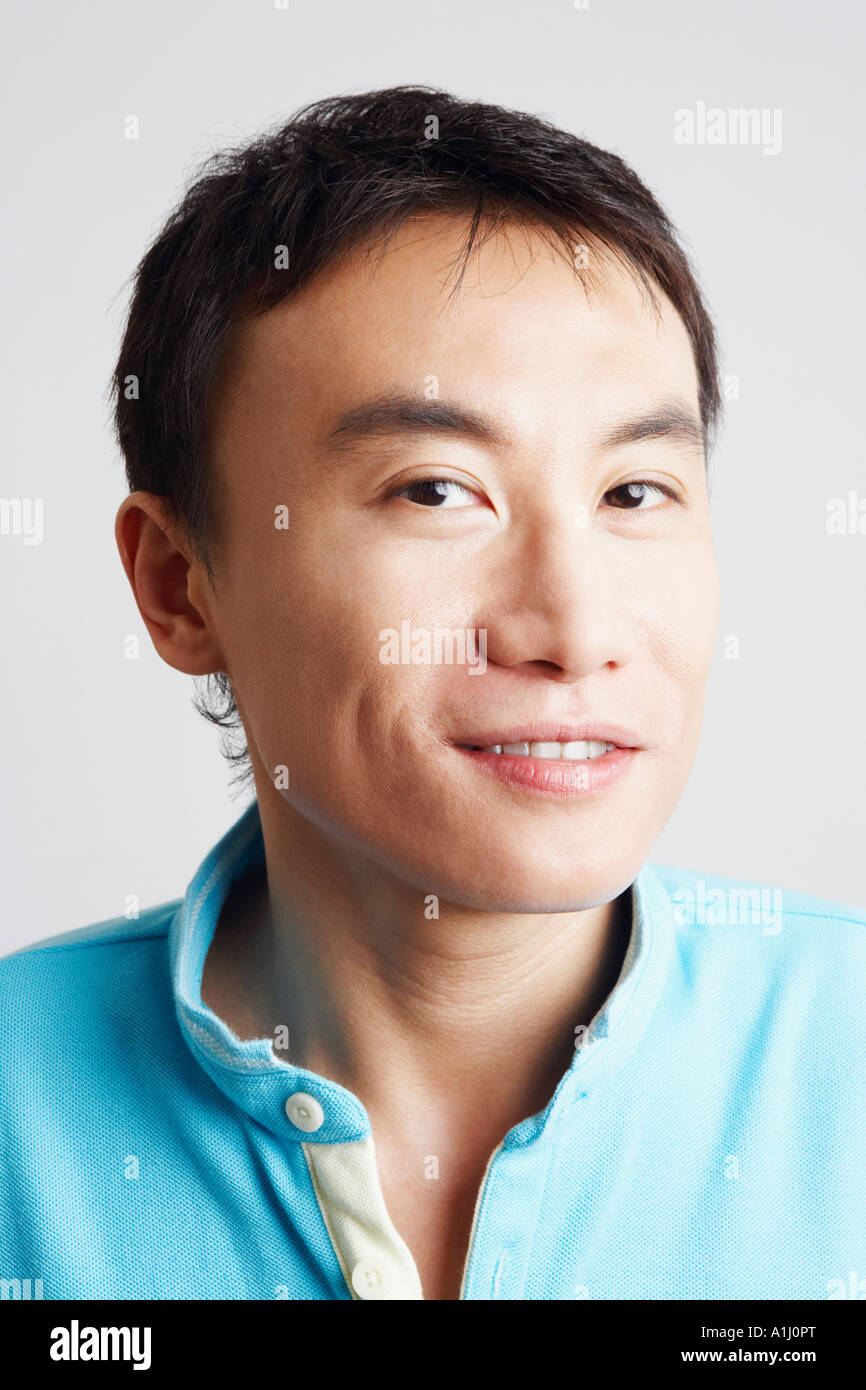Portrait of a young man smiling Stock Photo - Alamy