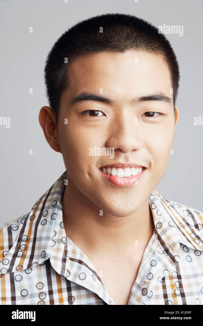 Portrait of a young man smiling Stock Photo - Alamy