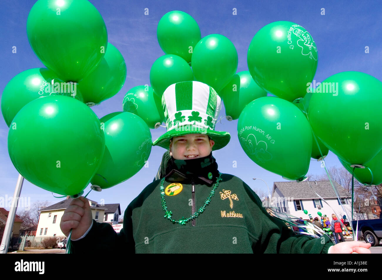 Activities at a Saint Patrick s Day Parade in Port Huron Michigan child with green balloons Stock Photo