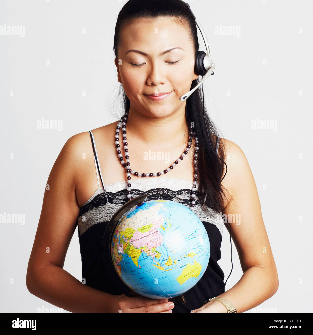 Hands holding up globe hi-res stock photography and images - Alamy