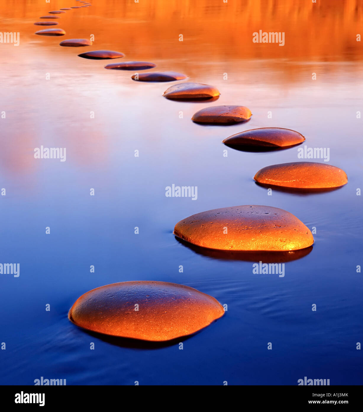 Stepping stones provide a safe passage through deep water Stock Photo