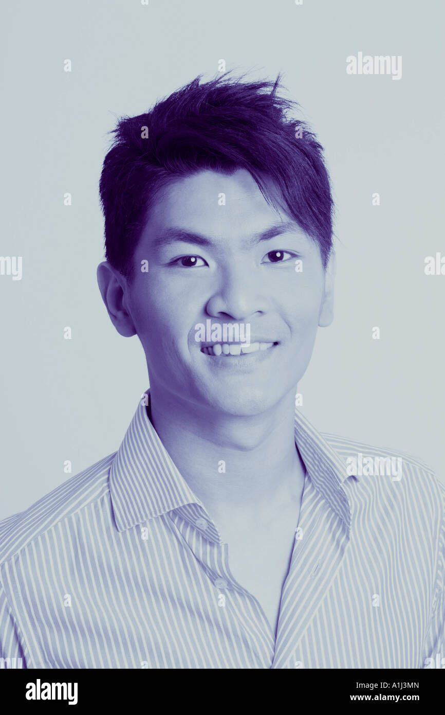 Portrait of a young man smiling Stock Photo - Alamy